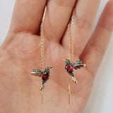 Silver and zirconia earrings in the shape of a hummingbird